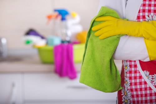 Cleaner using protective equipment while working on carpets