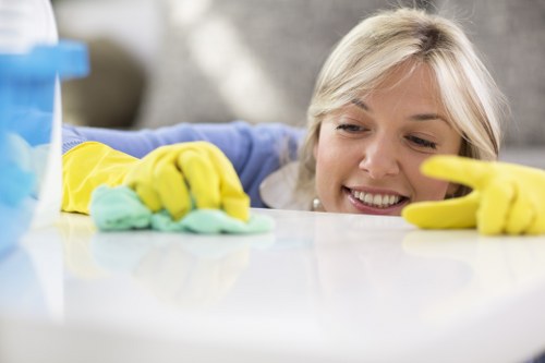Trained carpet cleaner using safe methods and protective equipment