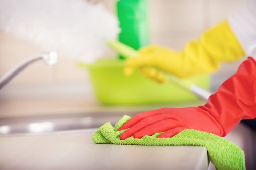 Local technician cleaning a sofa in a Hackney Wick property